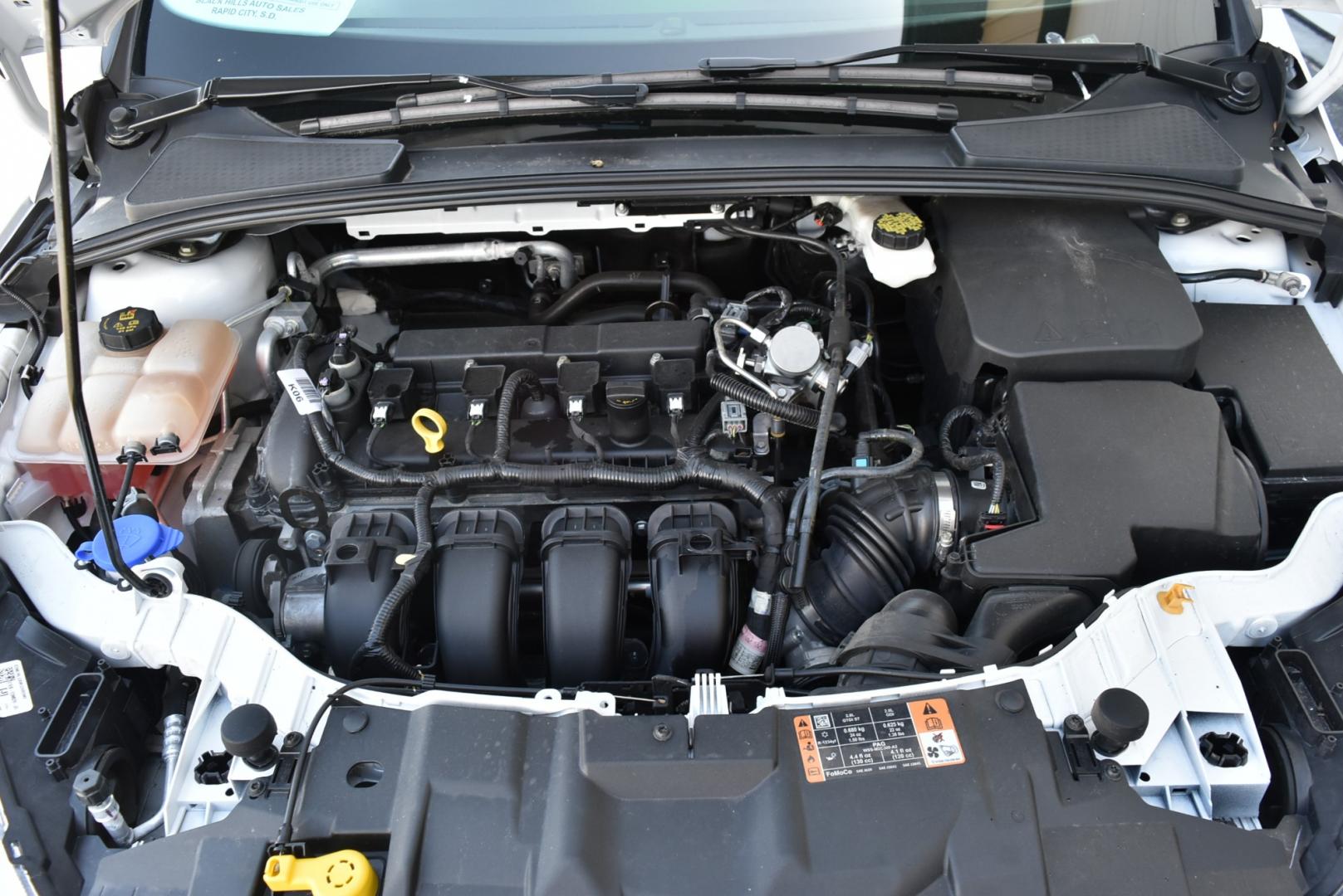 2018 White /Black Ford Focus SE (1FADP3F22JL) with an 2.0L I-4 GDI TI-VCT engine, 6-Speed Powershift Automatic transmission, located at 1600 E Hwy 44, Rapid City, SD, 57703, (605) 716-7878, 44.070232, -103.171410 - Photo#26